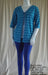 Plus size blue stripe tie front jacket worn with leggings and singlet