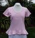 baby pink women's cotton top with frilly peplum