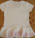 back view of white embroidered cotton womens top with peplum